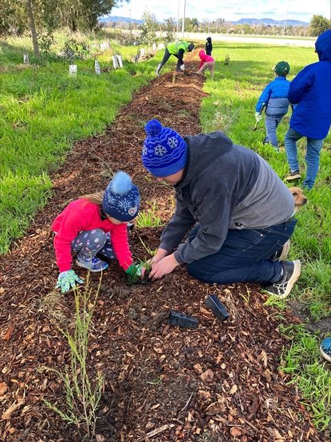 National Tree Day_Father and Daughter Planting (1).jpeg