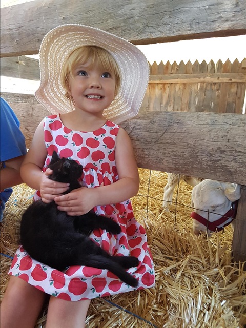 2 Eloise enjoying the Farmyard Nursery by Louise Butlin.jpg